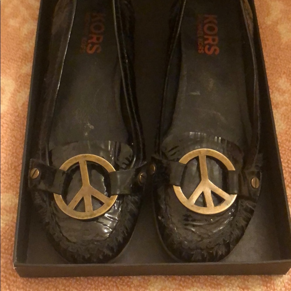 Michael Kor’s  7.5 Peace sign black patent flats